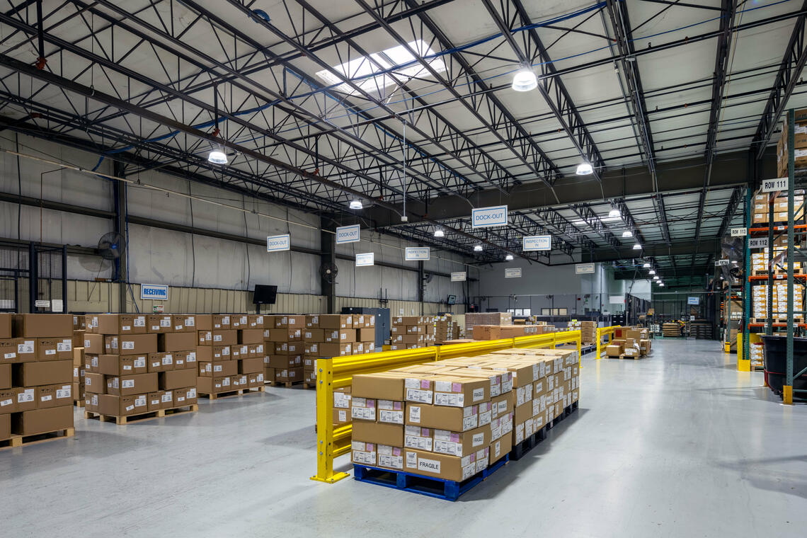 Warehouse space with high bay lighting and Lightcloud Blue controls. 
